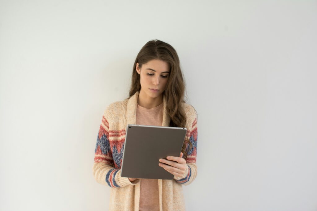 A woman using a tablet, reviewing a treating psychiatrist’s opinion in a Supplemental Security Income (SSI) case.