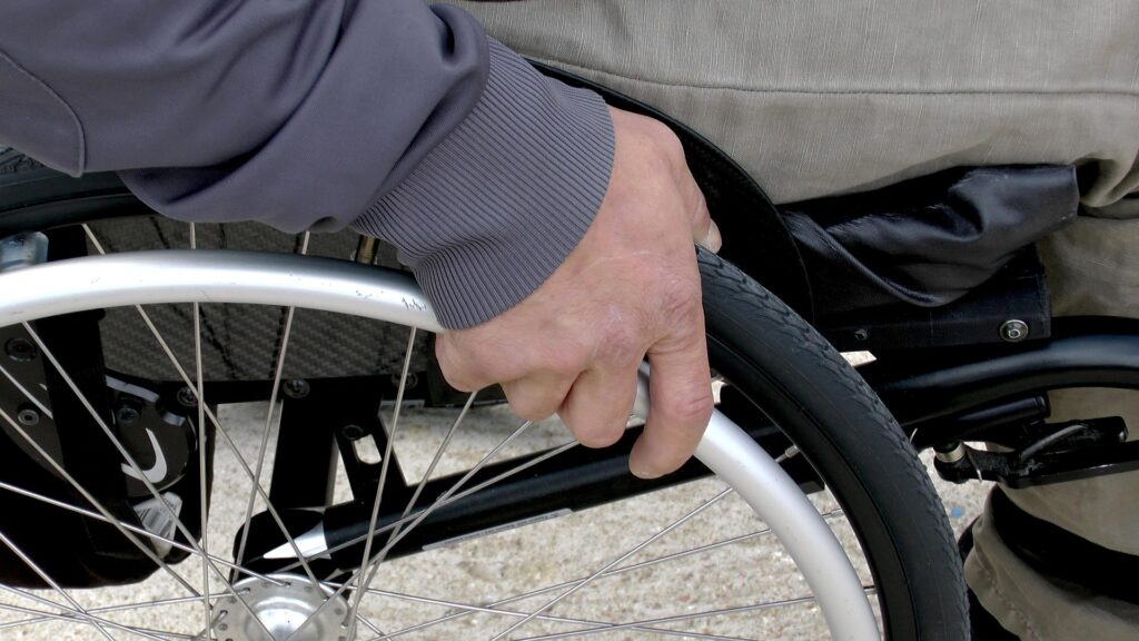A man in a wheelchair, representing cases where an ALJ fails to consider certain impairments in California SSI and SSDI claims.