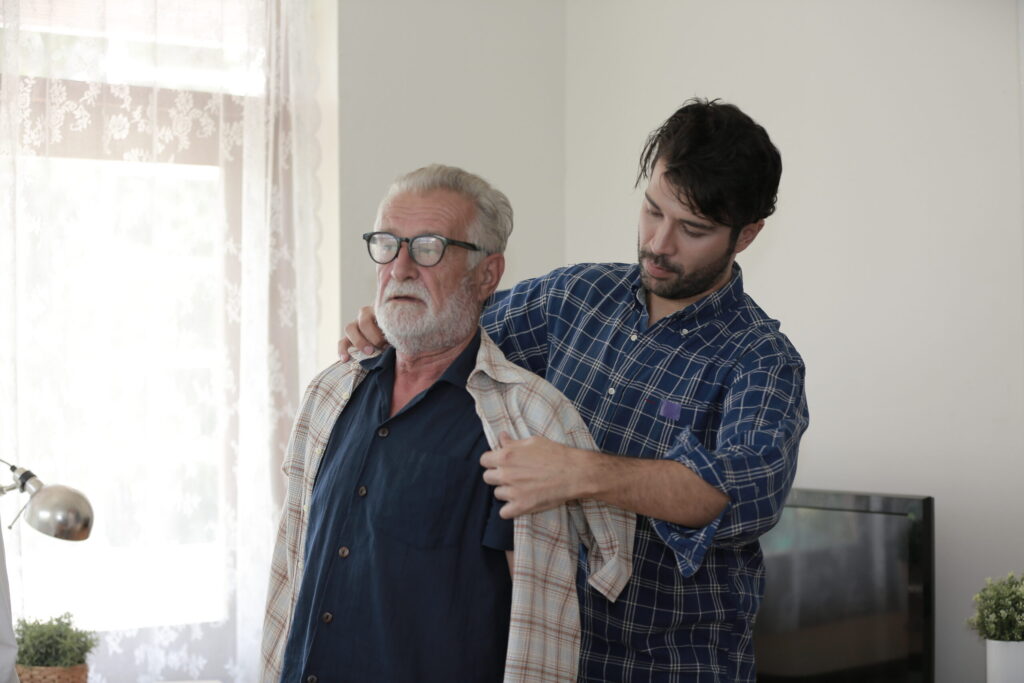 A man caring for an elderly parent, exploring whether an adult child can collect Social Security benefits.