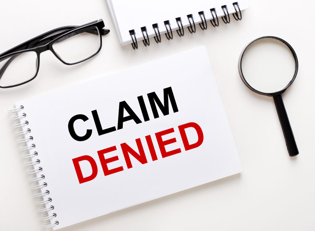 A close-up of a paper showing a denied claim, highlighting common reasons short-term disability claims are denied and how to address them.