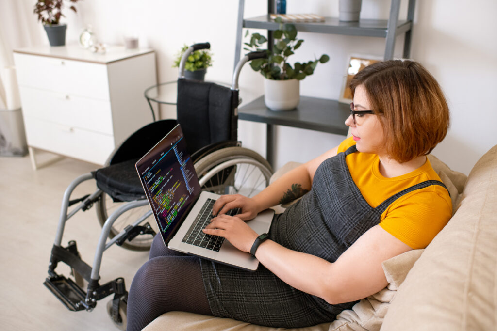 Disabled woman coding at home - What Conditions Automatically Qualify You for Disability in California