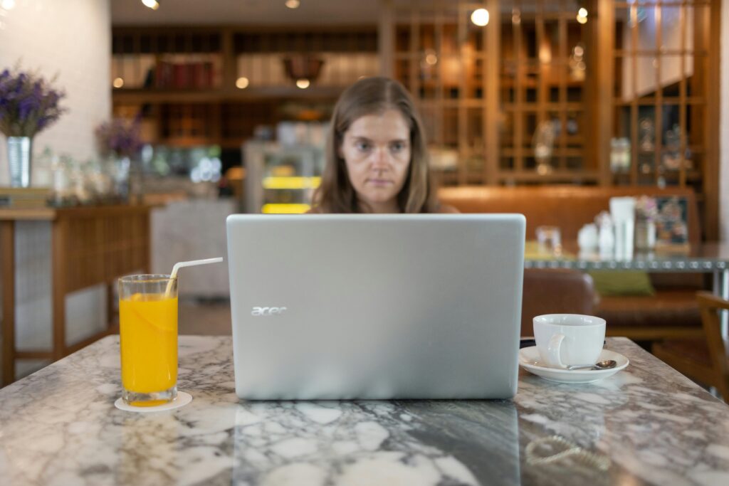 A woman using a laptop to research eligibility requirements for Social Security Disability Insurance (SSDI).
