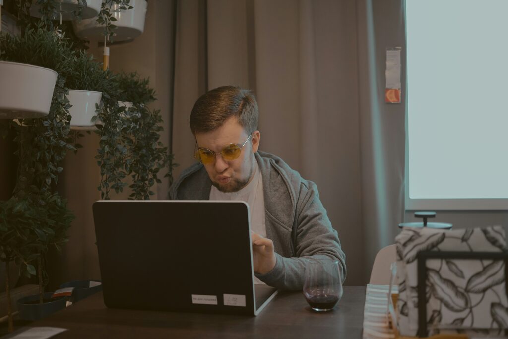 A man using a laptop to research steps to take if his Social Security Disability claim is denied in Fresno, California.